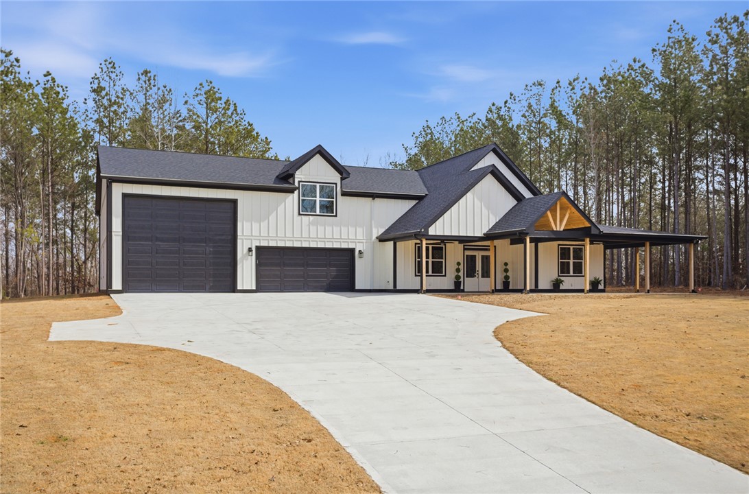 147 McAlister Road West Union, SC 29696 - Photo 41 of 49 This newly constructed home features a crisp white facade, inviting entrance, and attached garages.