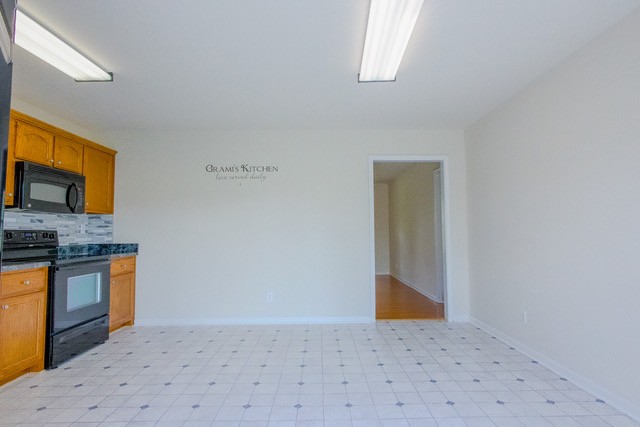 4272 J L Head Road Cedar Hill, TN 37032 - Photo 12 of 30 a bedroom with a bed and a television