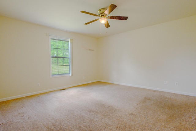 4272 J L Head Road Cedar Hill, TN 37032 - Photo 23 of 30 an empty room with windows and fan