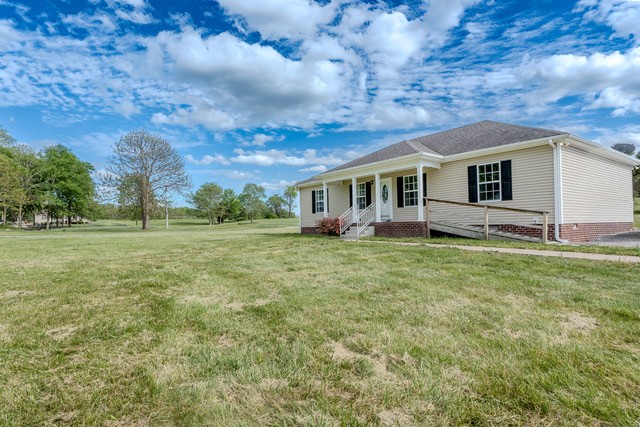 4272 J L Head Road Cedar Hill, TN 37032 - Photo 29 of 30 a view of a house with a backyard