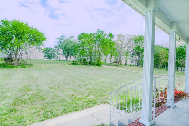 4272 J L Head Road Cedar Hill, TN 37032 - Photo 8 of 30 a backyard of a house with lots of green space and fountain