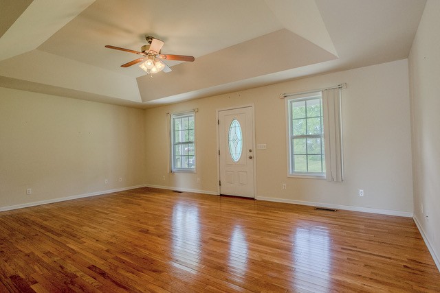 4272 J L Head Road Cedar Hill, TN 37032 - Photo 9 of 30 a view of an empty room with wooden floor and a window