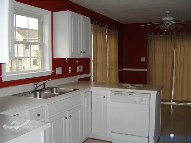 a kitchen with a sink and cabinets