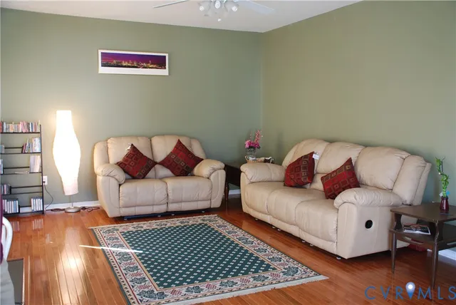 a living room with furniture and a rug