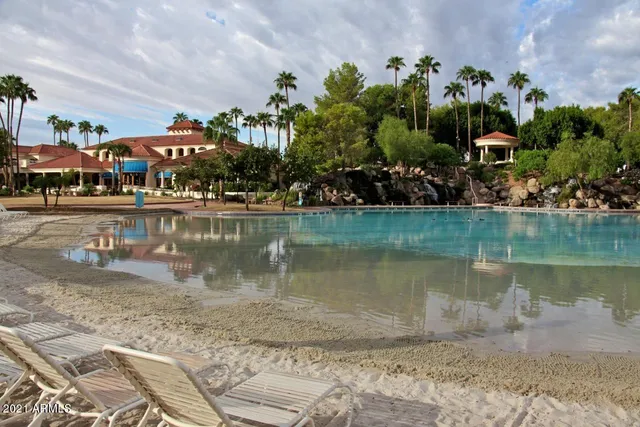 an aerial view of lake and residential houses with outdoor space