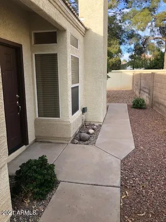 a backyard of a house with seating space