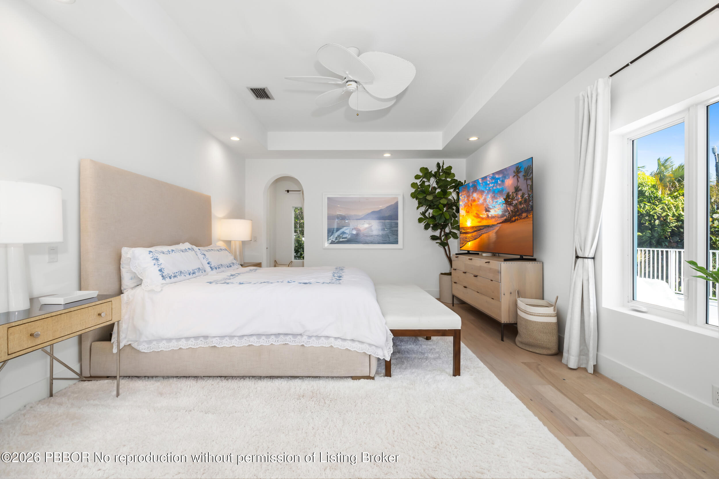 121 Seville Road West Palm Beach, FL 33405 - Photo 35 of 67 a spacious bedroom with a bed and a flat screen tv
