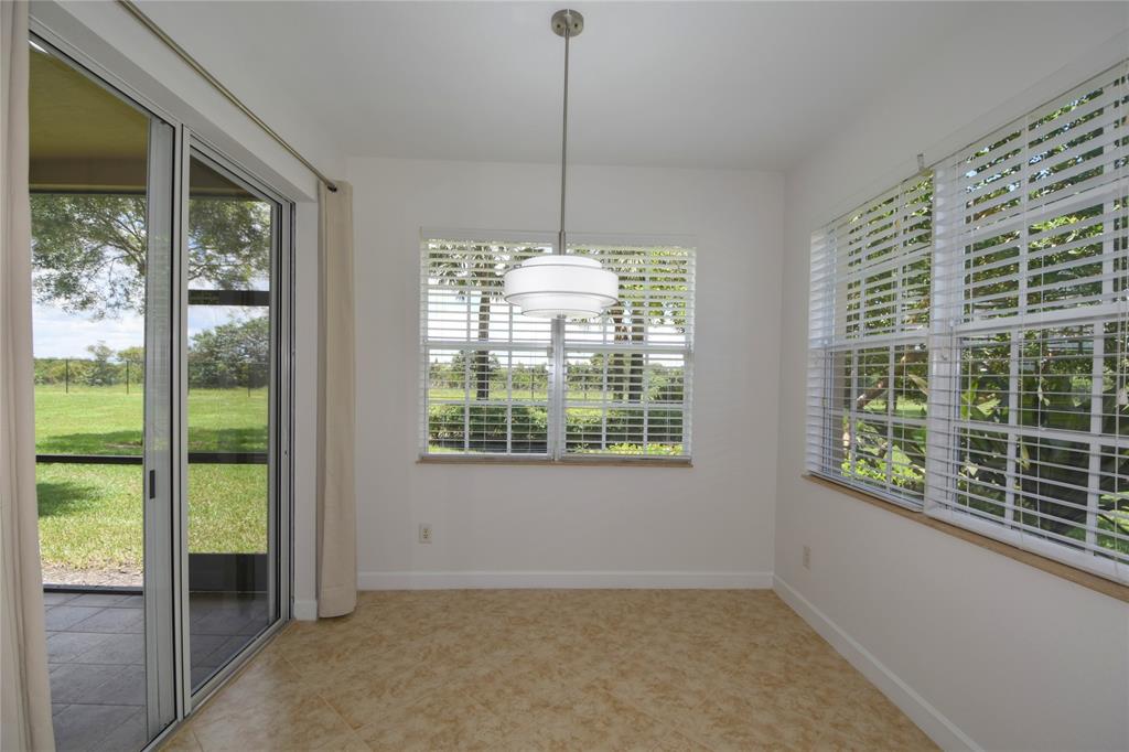 8297 Northwest 128th Lane, Unit 20C Parkland, FL 33076 - Photo 11 of 42 a view of an empty room with windows