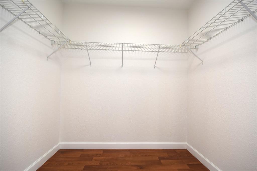 8297 Northwest 128th Lane, Unit 20C Parkland, FL 33076 - Photo 16 of 42 a view of a room with racks on the wall