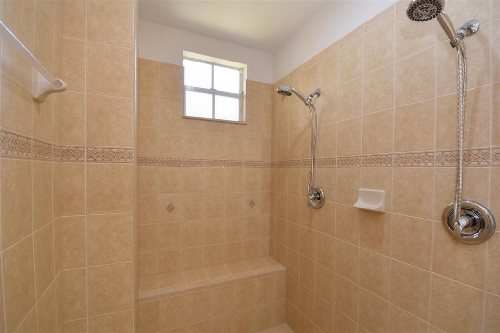 8297 Northwest 128th Lane, Unit 20C Parkland, FL 33076 - Photo 20 of 42 a bathroom with a shower