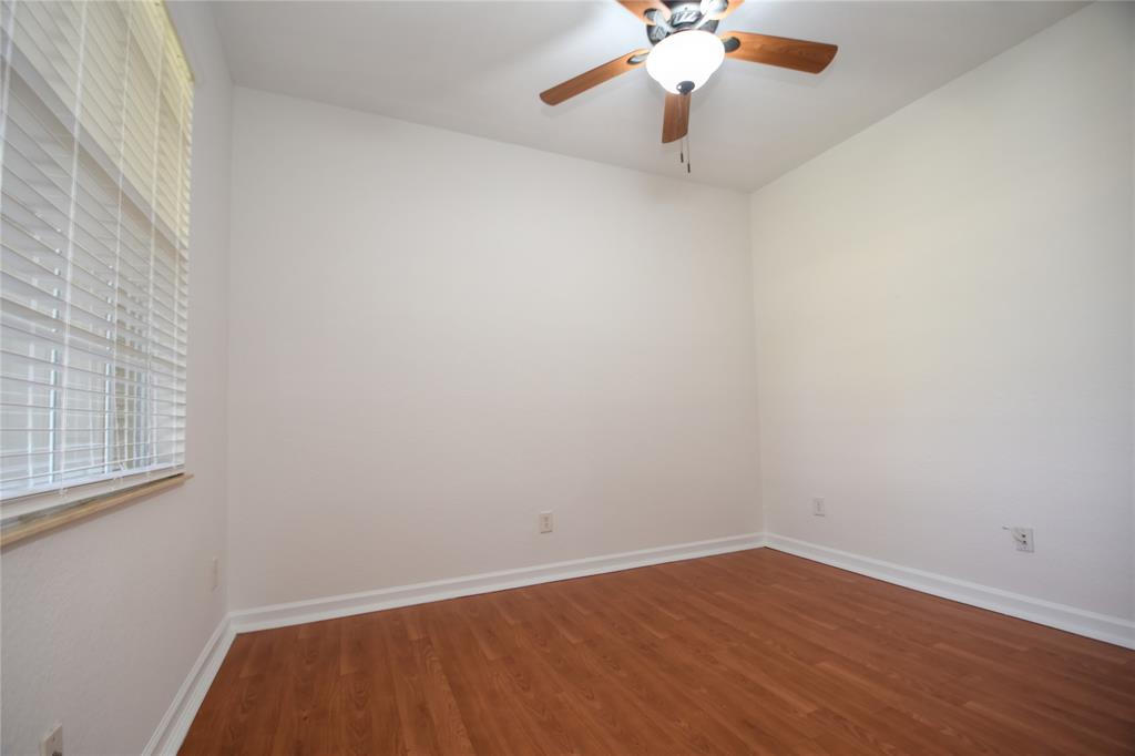 8297 Northwest 128th Lane, Unit 20C Parkland, FL 33076 - Photo 22 of 42 a view of a room with wooden floor and fan