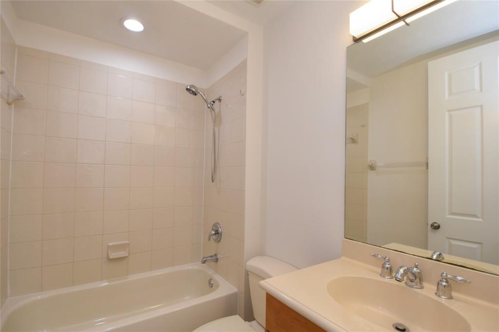 8297 Northwest 128th Lane, Unit 20C Parkland, FL 33076 - Photo 24 of 42 a bathroom with a sink toilet and shower