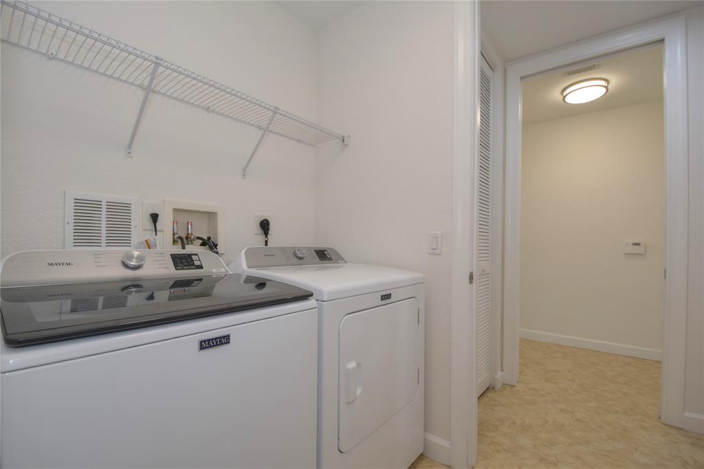 8297 Northwest 128th Lane, Unit 20C Parkland, FL 33076 - Photo 29 of 42 a bathroom with a sink and a mirror