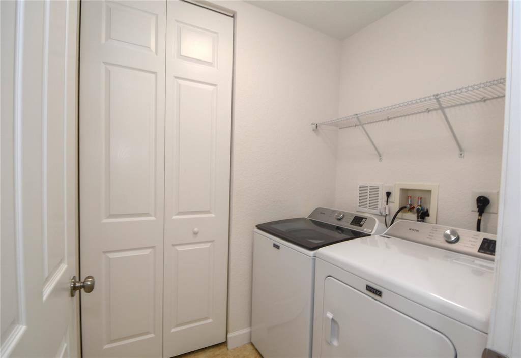 8297 Northwest 128th Lane, Unit 20C Parkland, FL 33076 - Photo 30 of 42 a utility room with dryer and washer