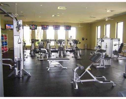 8297 Northwest 128th Lane, Unit 20C Parkland, FL 33076 - Photo 31 of 42 a view of a room with gym equipment