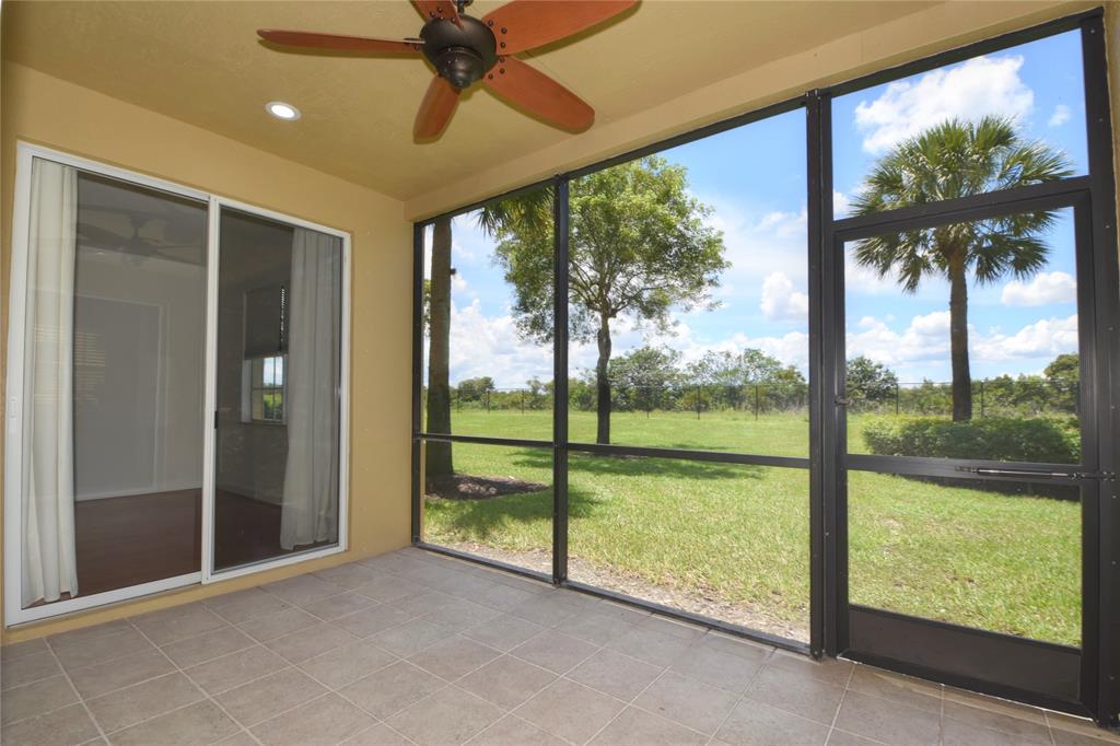 8297 Northwest 128th Lane, Unit 20C Parkland, FL 33076 - Photo 36 of 42 wooden floor in an empty room with a window