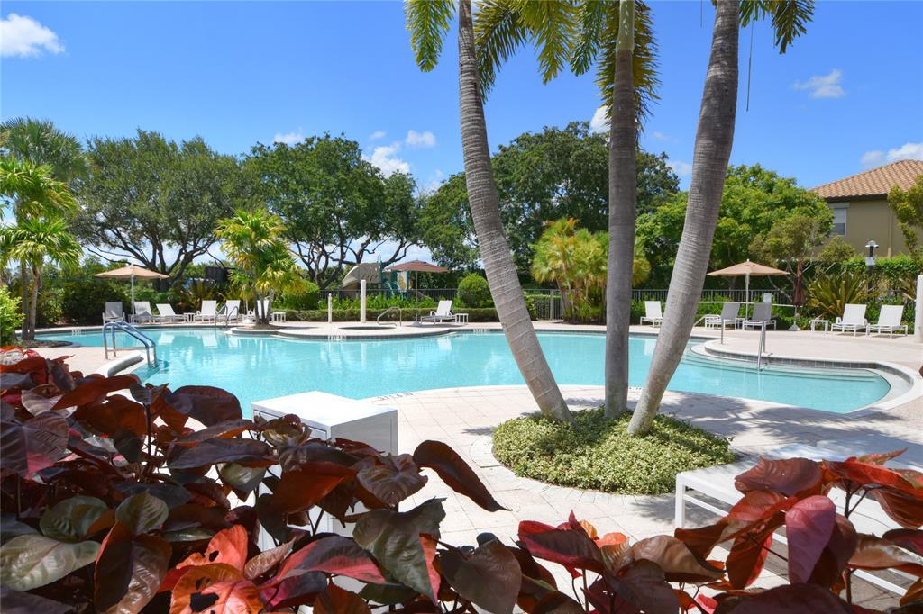 8297 Northwest 128th Lane, Unit 20C Parkland, FL 33076 - Photo 39 of 42 a view of a water fountain and a bench