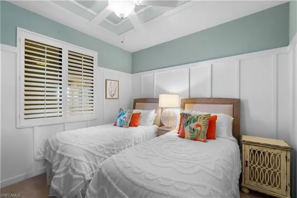 a bedroom with bed and window