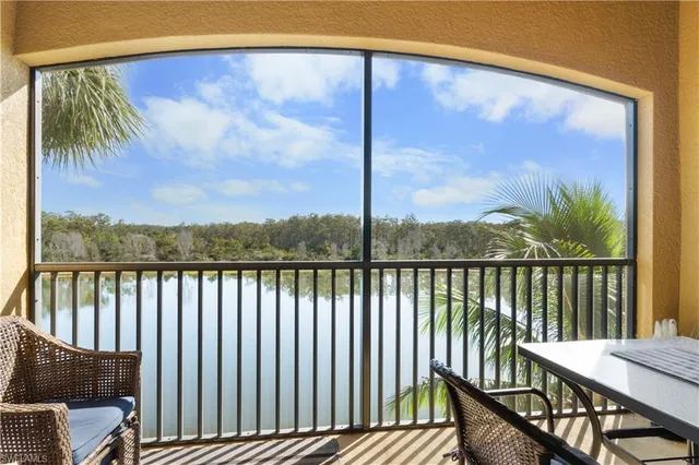 a view of a balcony with furniture