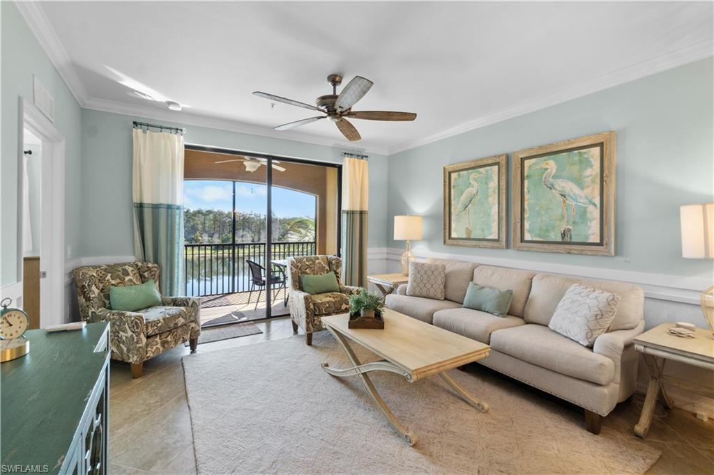 9578 Trevi Court, Unit 5135 Naples, FL 34113 - Photo 2 of 31 a living room with furniture and a large window