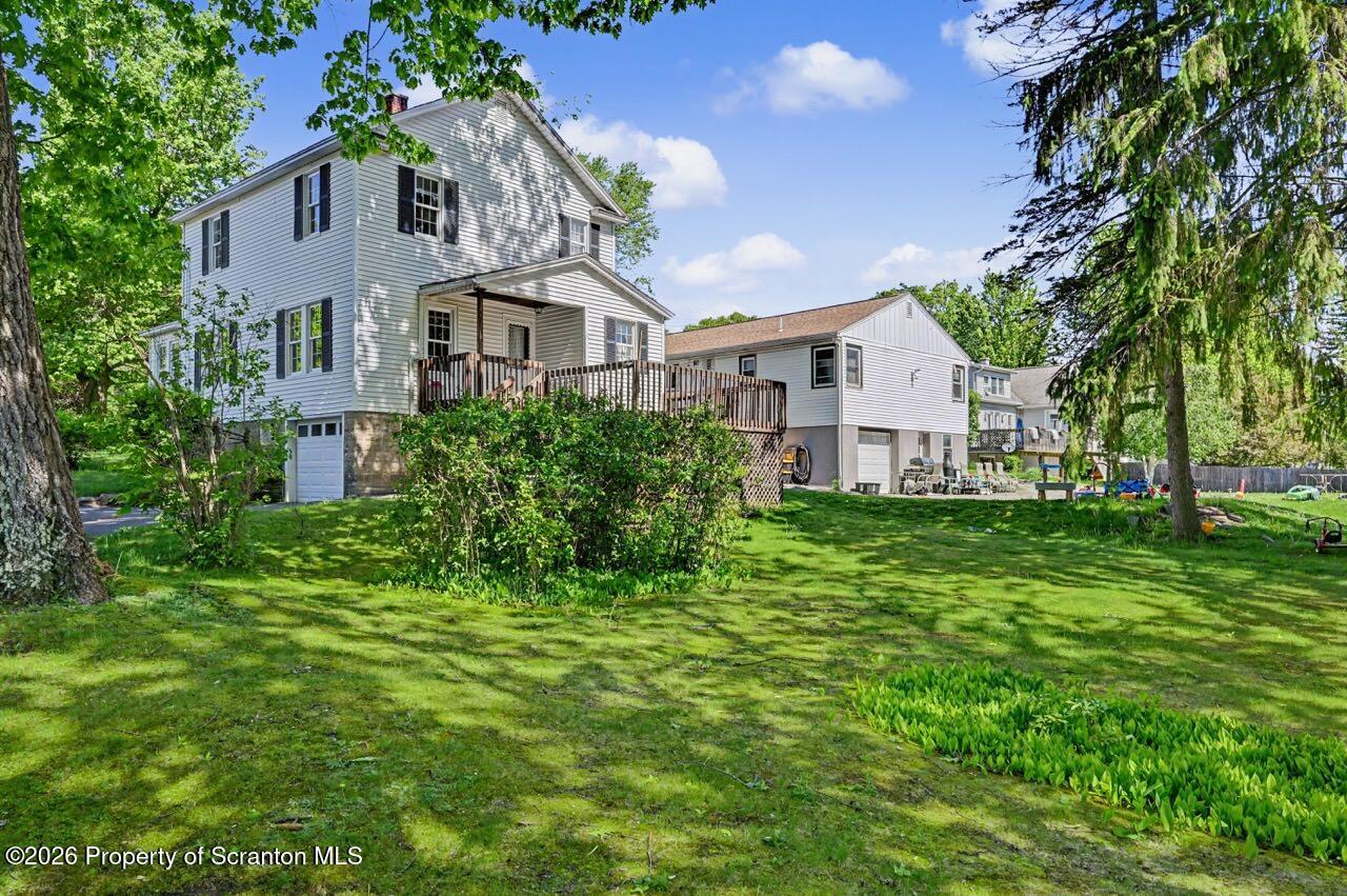 502 Layton Road Clarks Summit, PA 18411 - Photo 3 of 42 a front view of a house with a yard