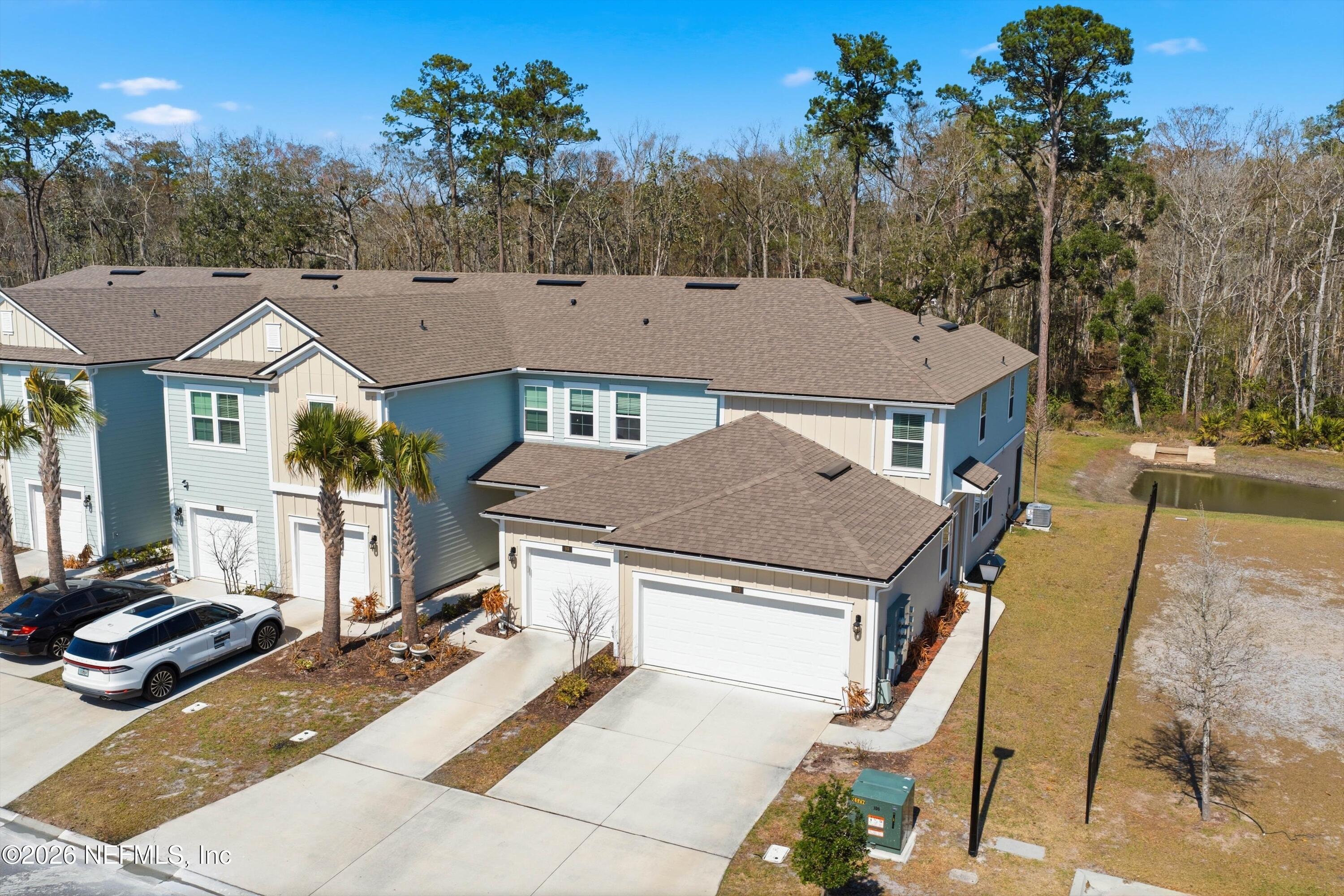103 Seaport Breeze Road St. Augustine, FL 32095 - Photo 38 of 44 a aerial view of a house with a yard