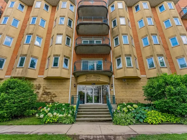 a front view of a multi story residential apartment building