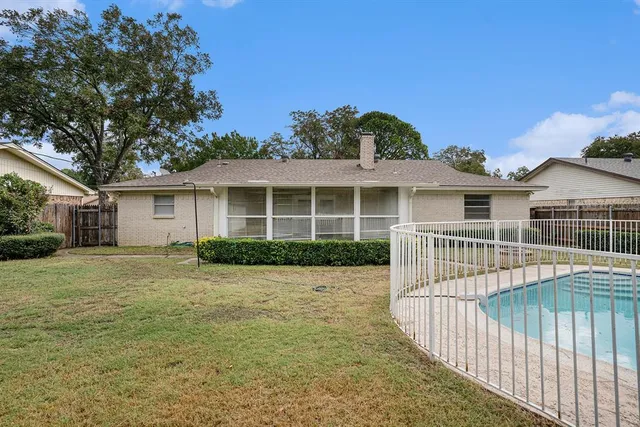 a view of a house with a yard and porch