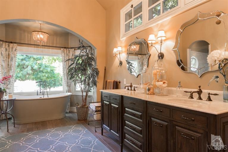 2748 Los Pinos Circle Camarillo, CA 93012 - Photo 19 of 37 a bathroom with a double vanity sink mirror and bathtub