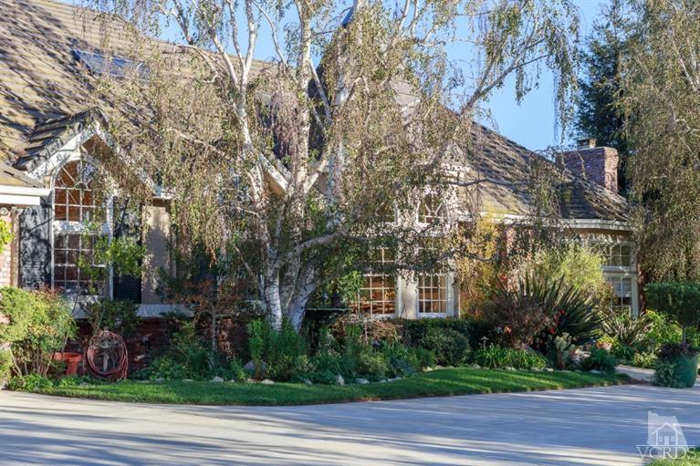2748 Los Pinos Circle Camarillo, CA 93012 - Photo 3 of 37 a front view of a house with a yard
