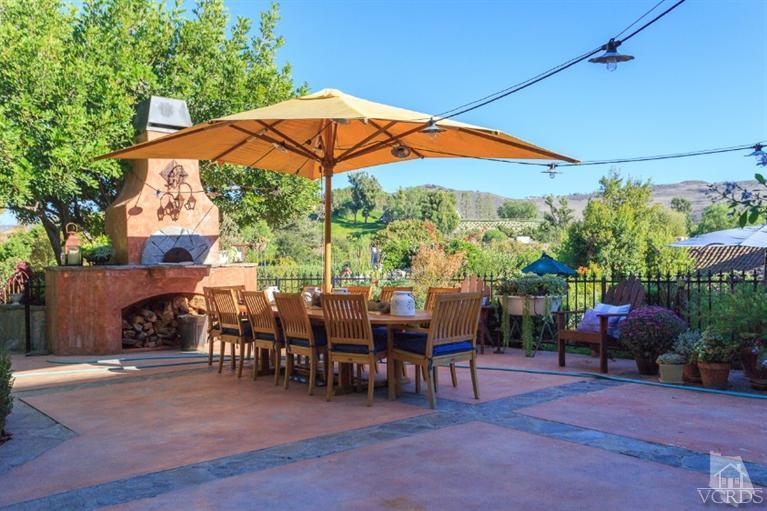 2748 Los Pinos Circle Camarillo, CA 93012 - Photo 21 of 37 a view of an outdoor sitting area with furniture and umbrella