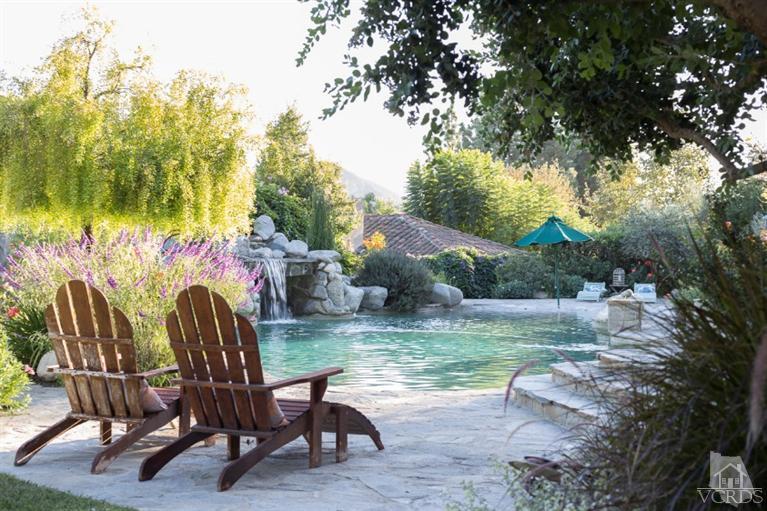 2748 Los Pinos Circle Camarillo, CA 93012 - Photo 31 of 37 a view of backyard with table and chairs and potted plants