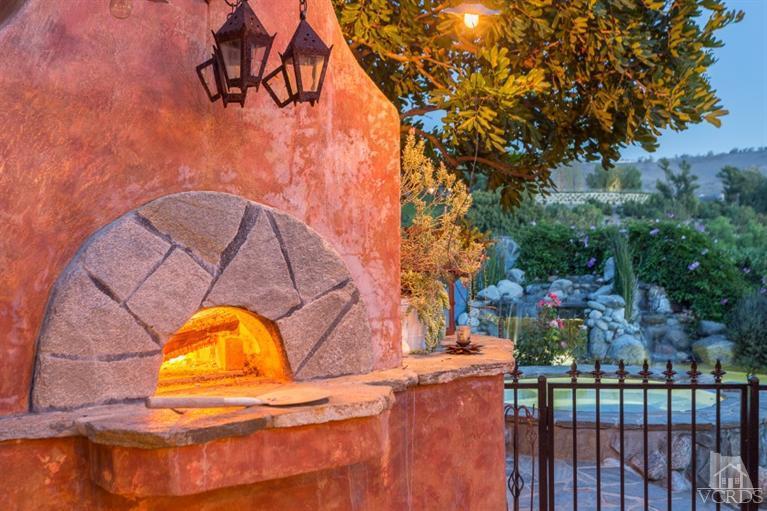 2748 Los Pinos Circle Camarillo, CA 93012 - Photo 36 of 37 a view of a swimming pool with a backyard and trees