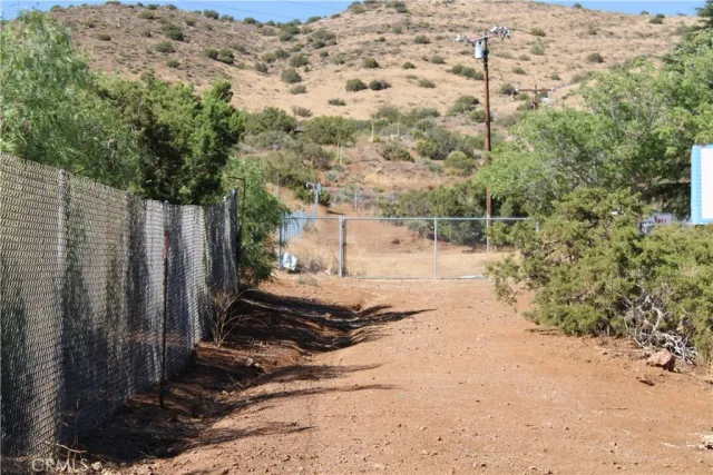 a view of a backyard of the house