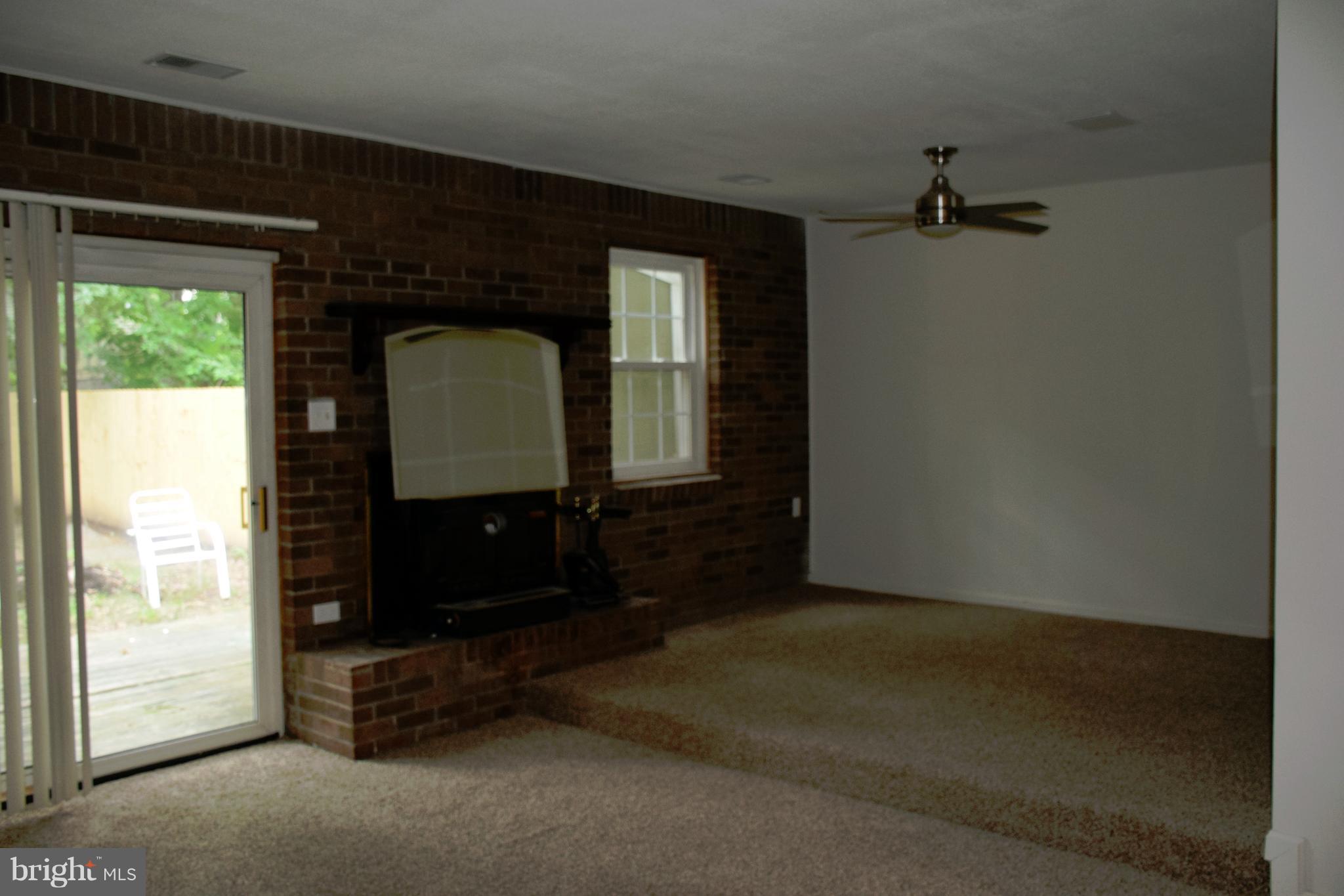 3366 Ryon Court Waldorf, MD 20601 - Photo 9 of 19 LIVING ROOM W/WOOD STOVE