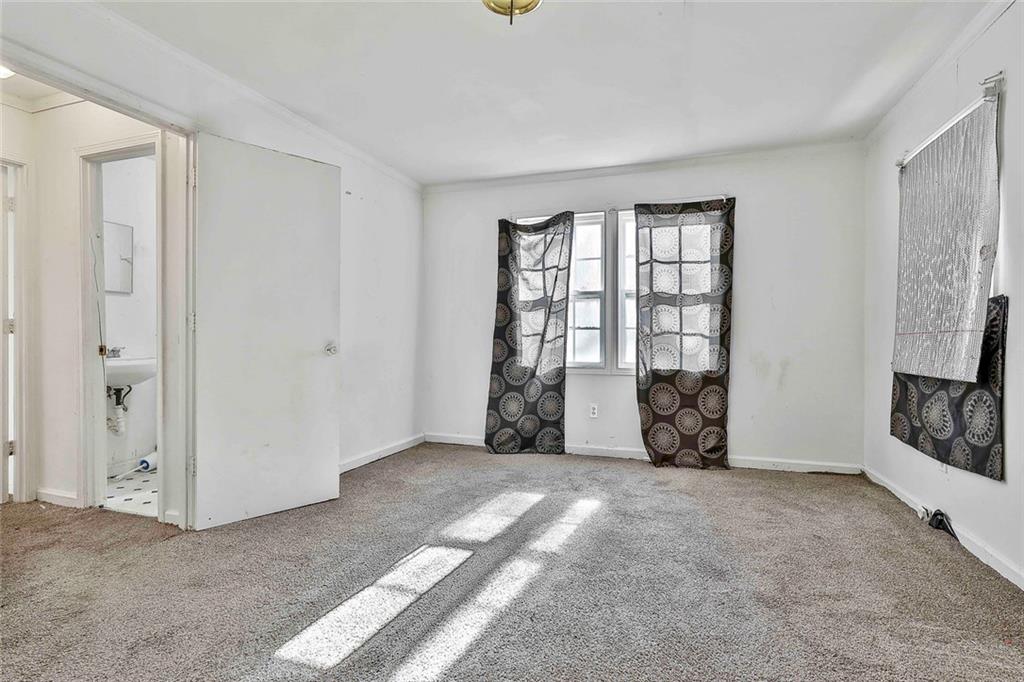 66 Howell Drive Southwest Atlanta, GA 30331 - Photo 13 of 27 an empty room with windows