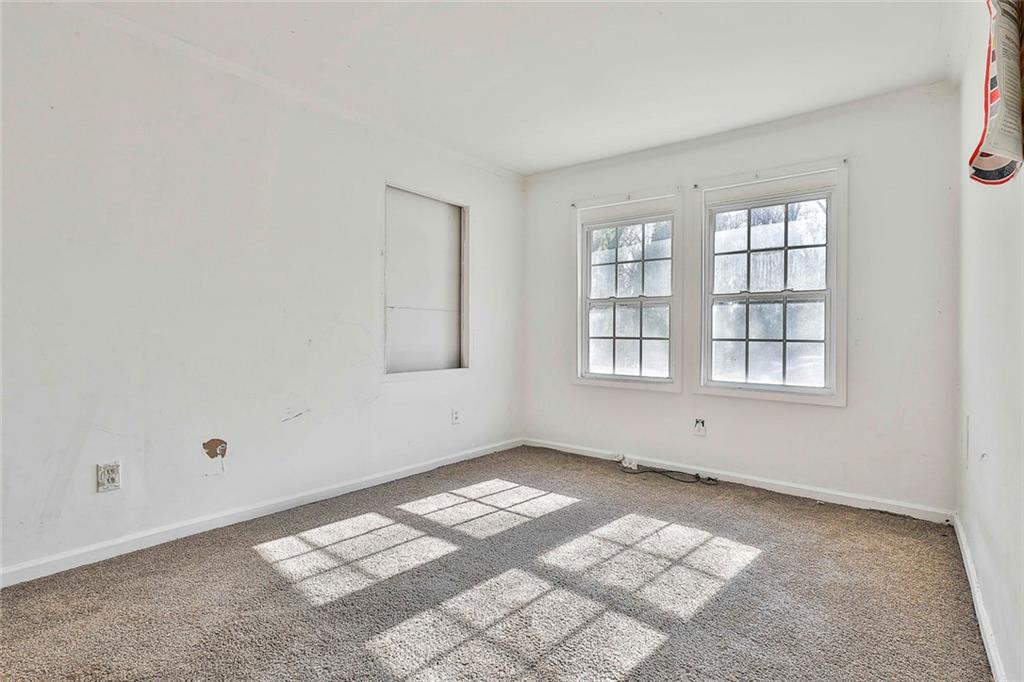 66 Howell Drive Southwest Atlanta, GA 30331 - Photo 15 of 27 an empty room with windows