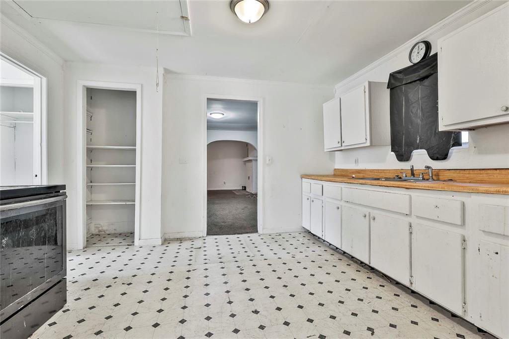 66 Howell Drive Southwest Atlanta, GA 30331 - Photo 19 of 27 a room with a sink and a mirror