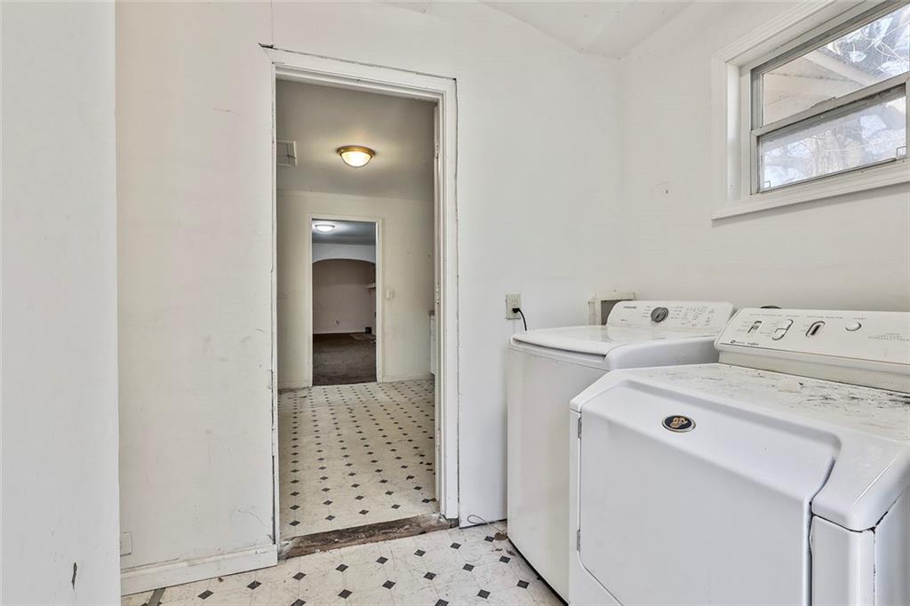 66 Howell Drive Southwest Atlanta, GA 30331 - Photo 20 of 27 a utility room with dryer and washer