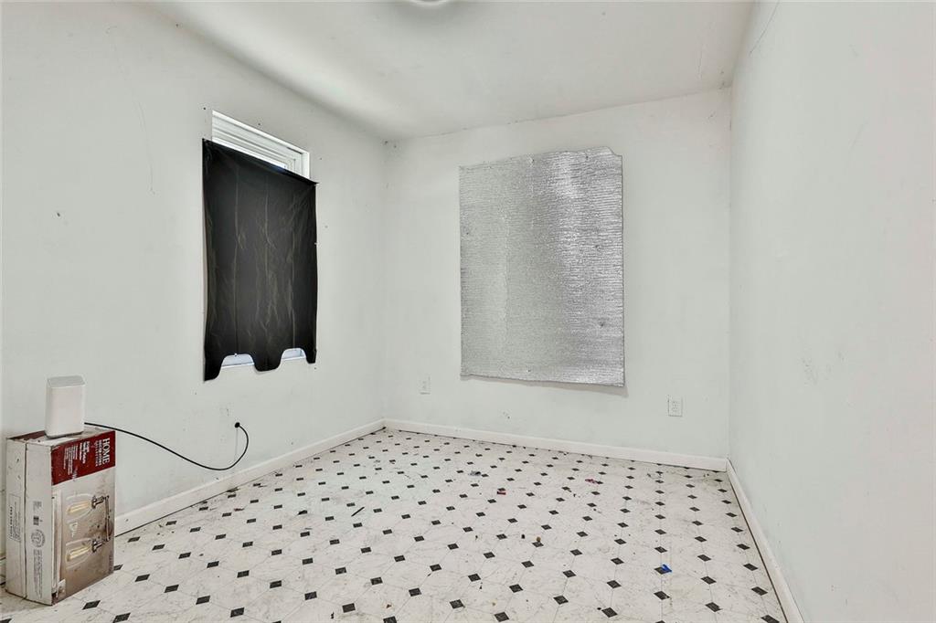 66 Howell Drive Southwest Atlanta, GA 30331 - Photo 21 of 27 a bedroom with a bed and a window