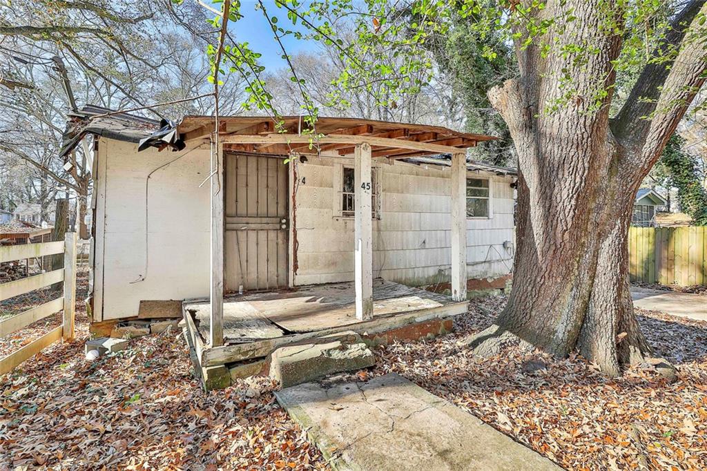 66 Howell Drive Southwest Atlanta, GA 30331 - Photo 25 of 27 a backyard of a house with table and chairs