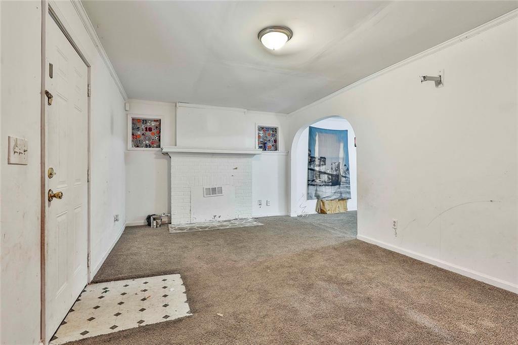 66 Howell Drive Southwest Atlanta, GA 30331 - Photo 7 of 27 an empty room with cabinet and mirrors