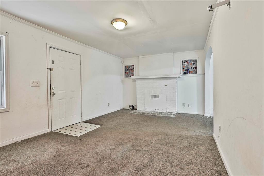 66 Howell Drive Southwest Atlanta, GA 30331 - Photo 8 of 27 an empty room with closet and windows