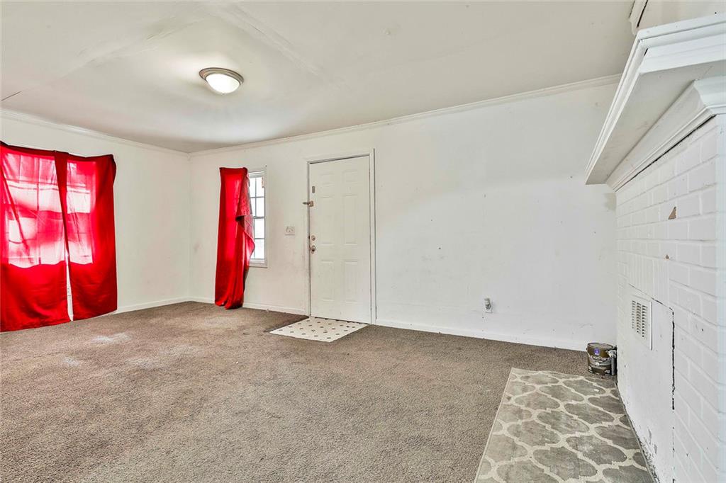 66 Howell Drive Southwest Atlanta, GA 30331 - Photo 9 of 27 a view of empty room with window