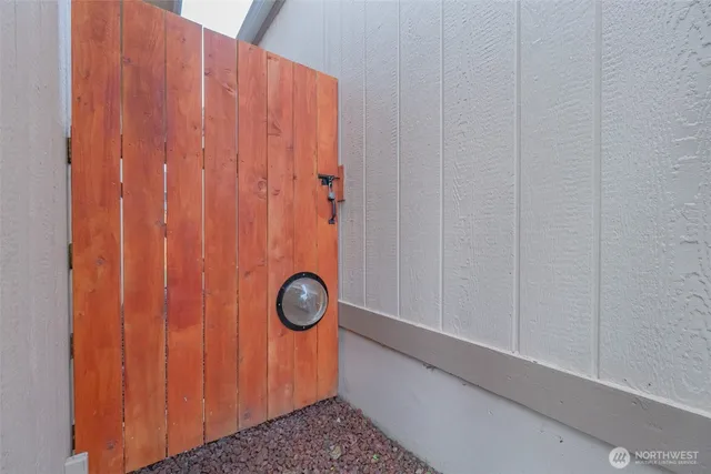 a backyard of a house with plants and entertaining space