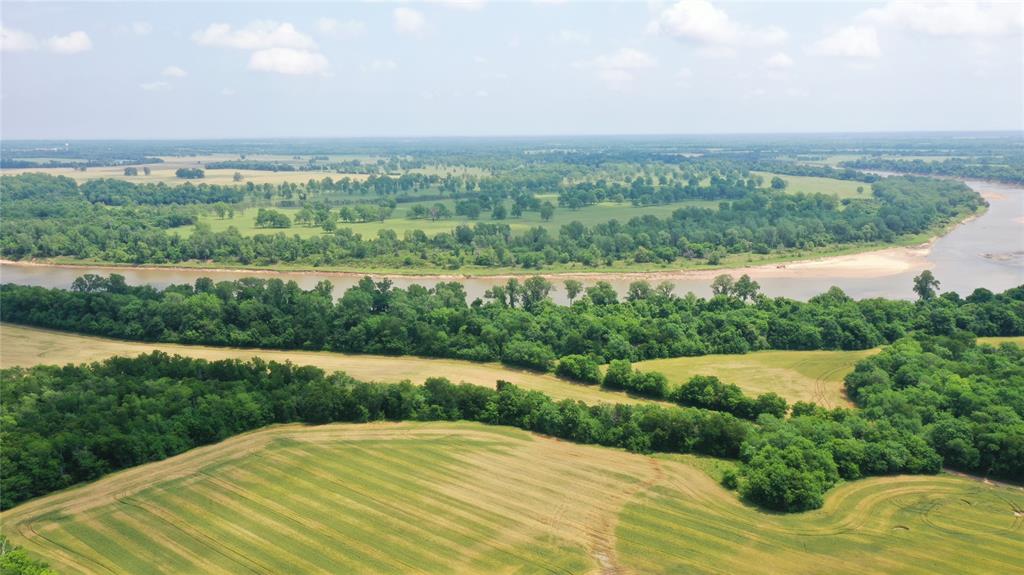 36980 Rd Arthur City Tx 75411 Road Arthur City, TX 75411 - Photo 17 of 23 a view of a lake with a big yard