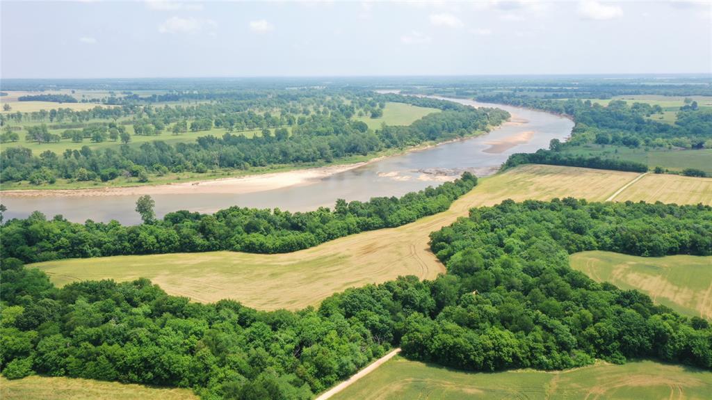 36980 Rd Arthur City Tx 75411 Road Arthur City, TX 75411 - Photo 7 of 23 a view of a lake with a yard