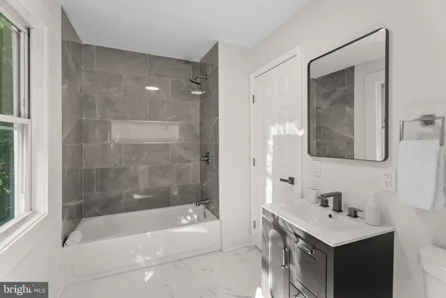 a bathroom with a sink and a bathtub