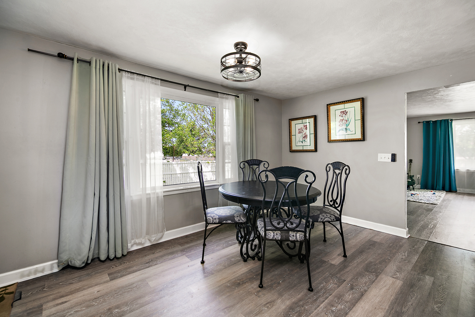1572 North 2000E Road Bourbonnais, IL 60914 - Photo 8 of 18 a view of a dining room with furniture window and wooden floor