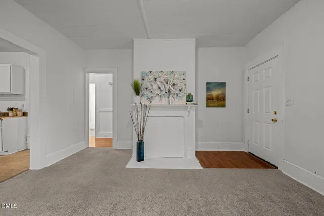 a view of livingroom with hardwood floor and cabinet